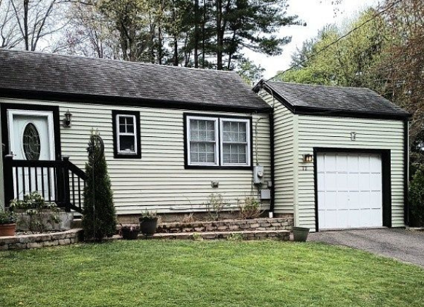 Wildern Road Berlin CT after siding replacement featuring cream vinyl siding