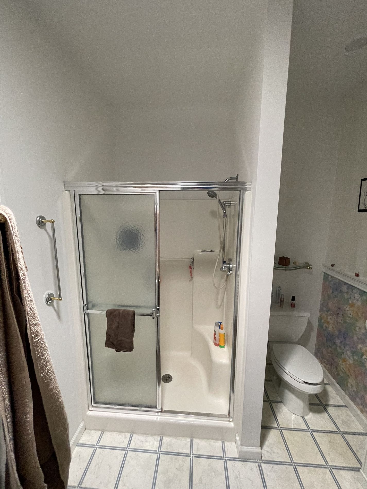 Original bathroom on Hawthorne Drive Berlin CT showing chrome framed shower with basic white acrylic surround before Nu-Face remodel