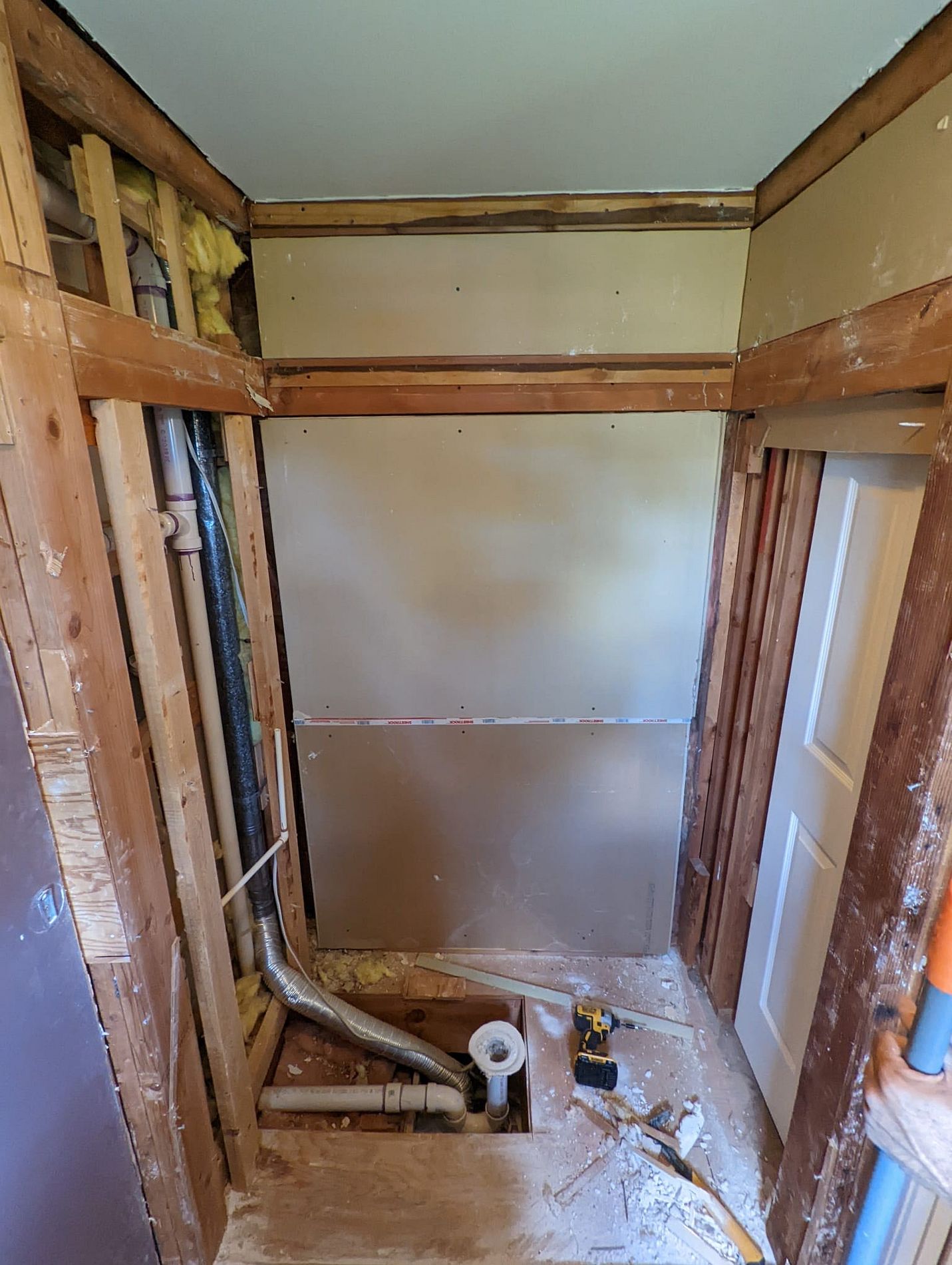 Hills Street East Hartford CT bathroom remodel in progress showing new Luxury Bath acrylic panel installation