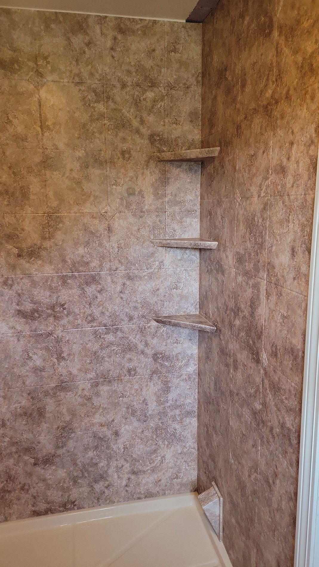 Completed bathroom remodel on Hills Street East Hartford CT showing new Luxury Bath acrylic wall panels and updated hardware