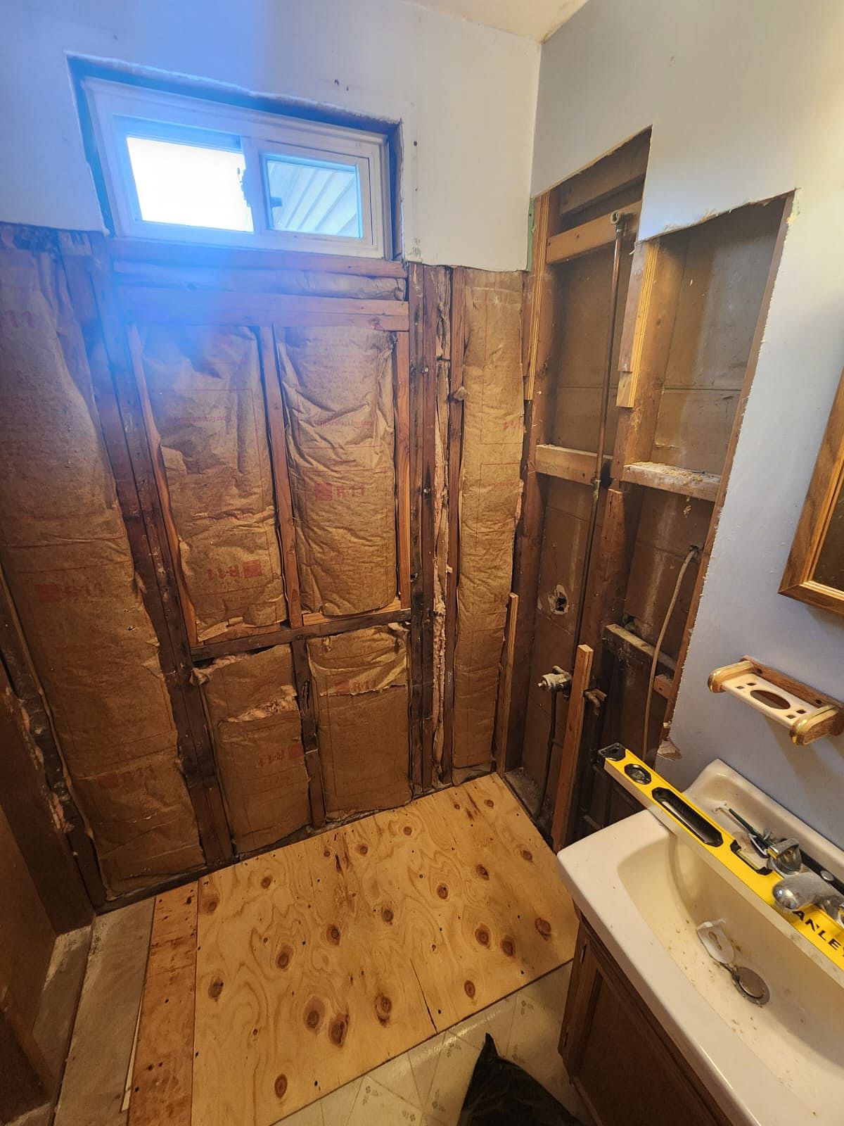 Millbrook Drive East Hartford CT bathroom remodel in progress showing partial Luxury Bath panel installation