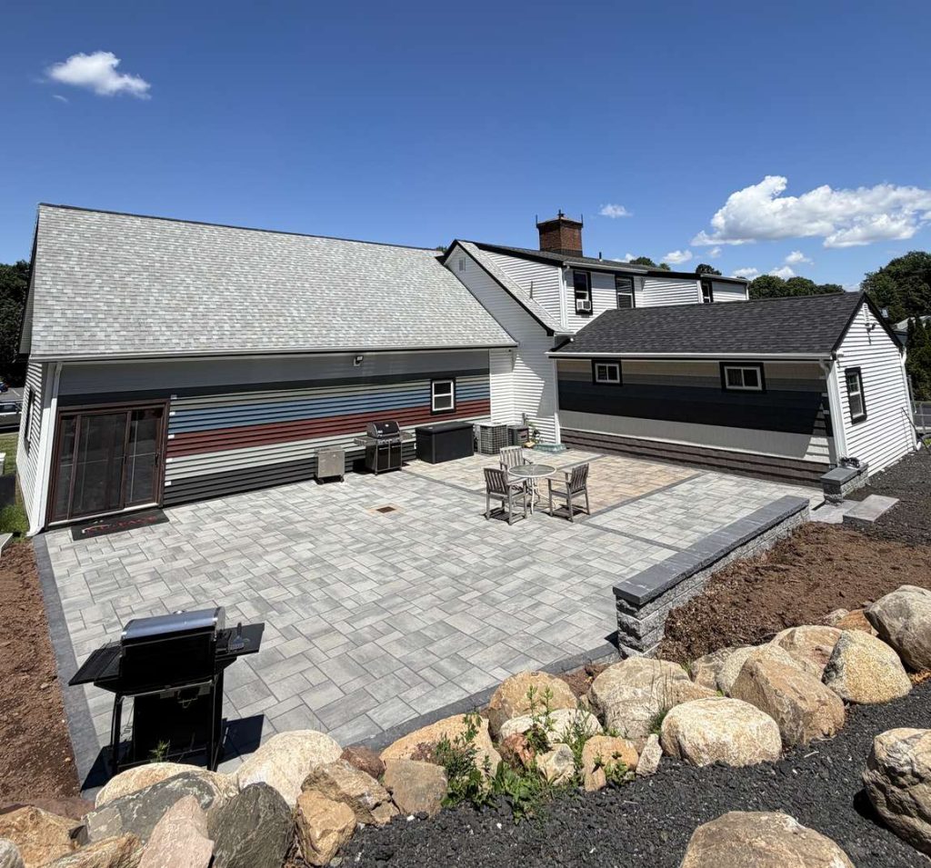 New paver patio and hardscape installation behind the Nu-Face Home Improvements showroom