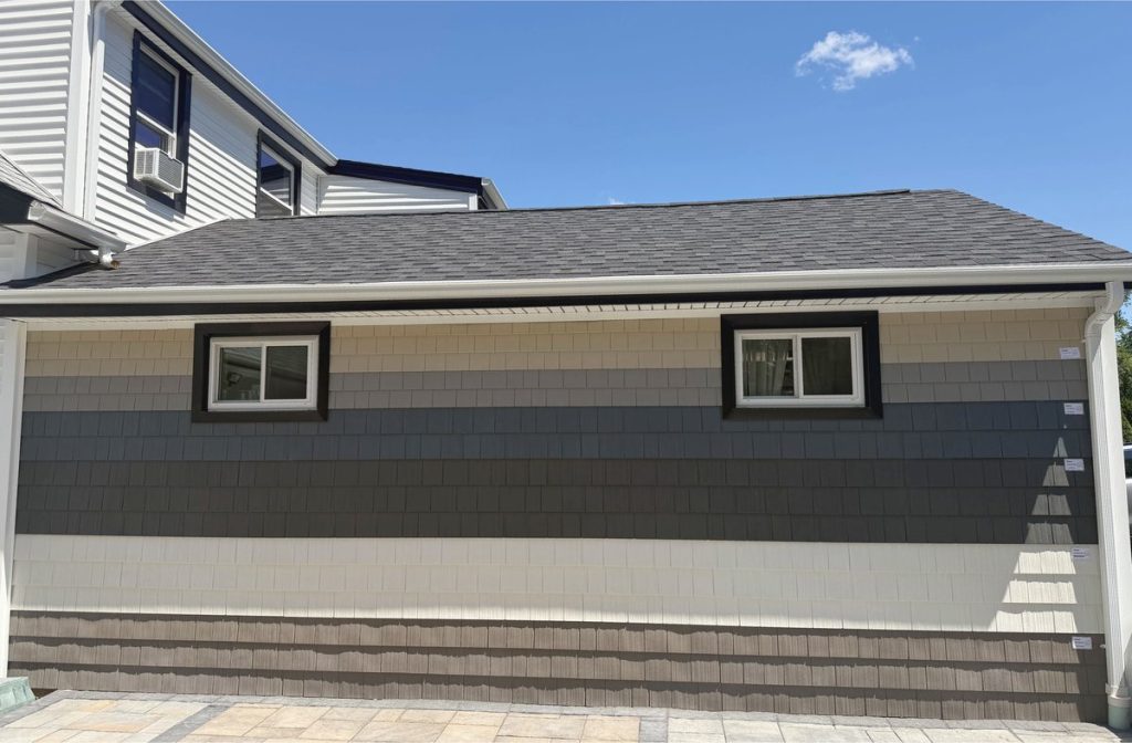 Outdoor siding display showing multiple shake-style siding colors