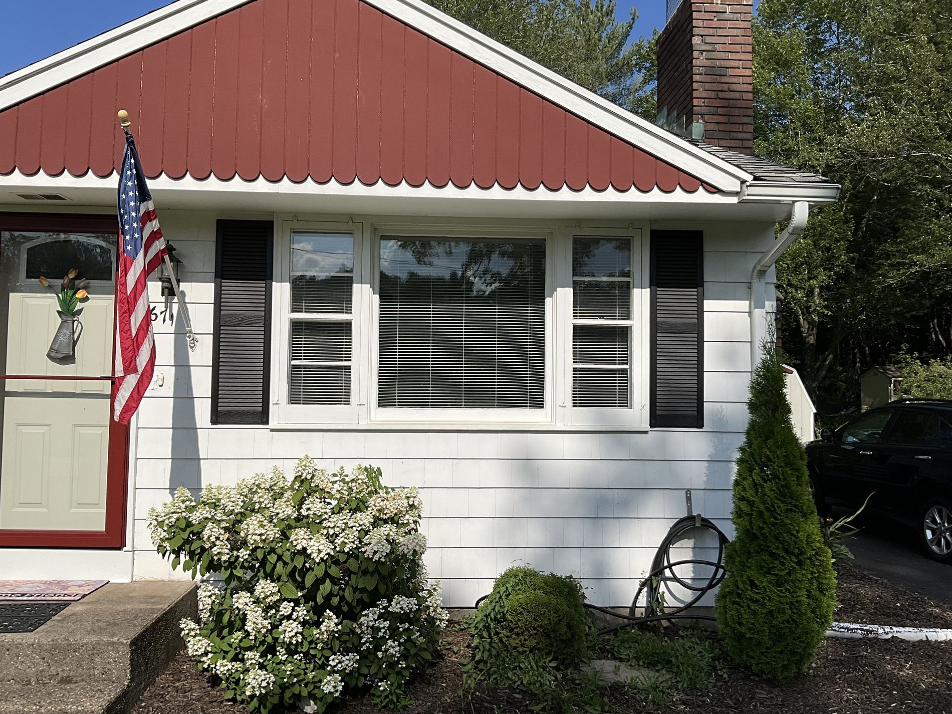 Rod Road Berlin CT home before window replacement showing original three window grouping with yellowed frames and failed glass seals