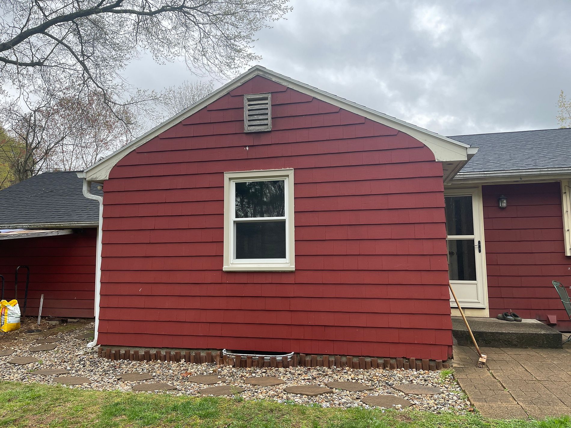 Round Hill Road Berlin CT home before siding replacement showing faded red painted wood siding in need of full replacement