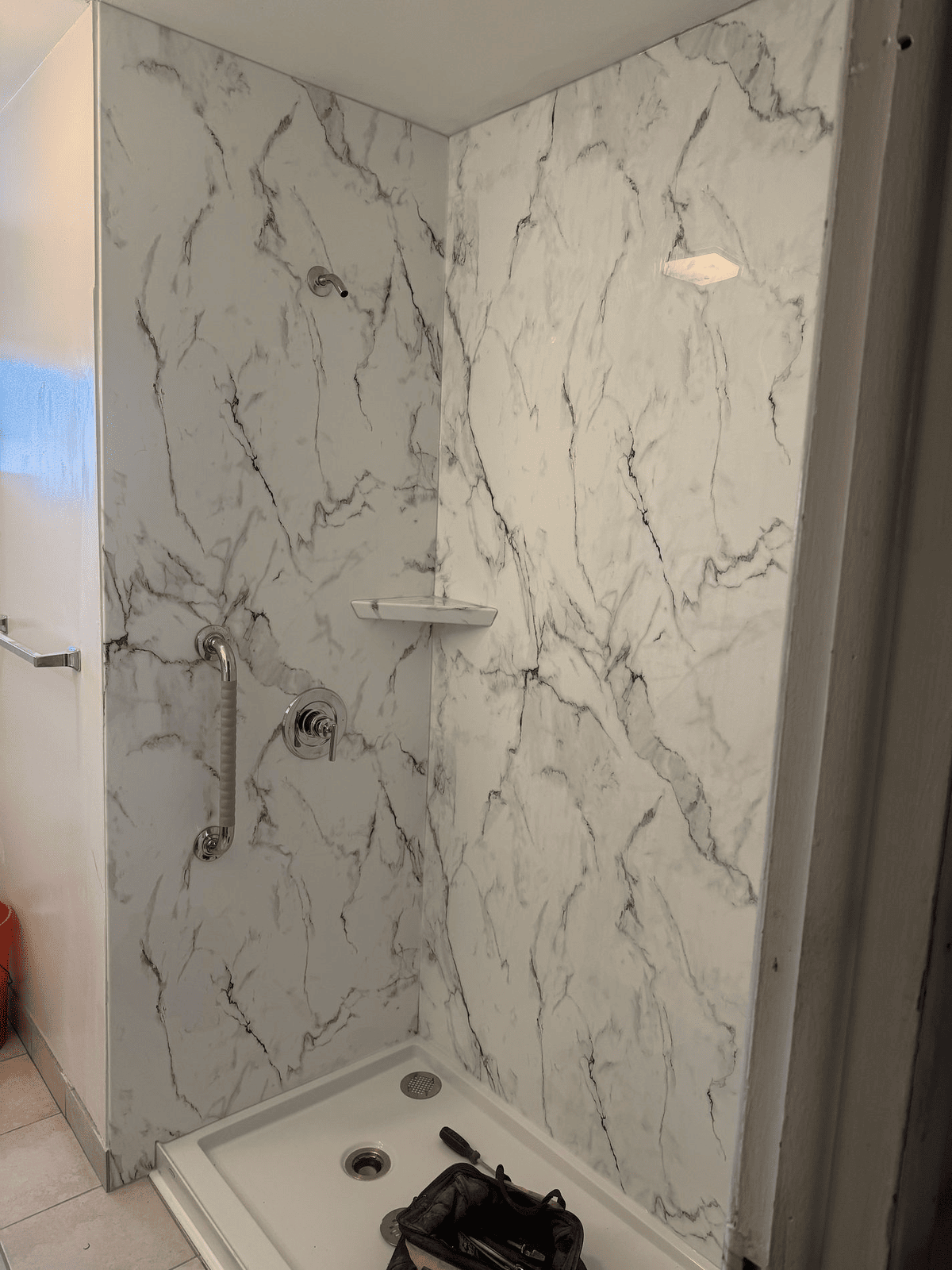 ompleted walk-in shower with grab bar and marble panel walls on Forbes Street East Hartford CT by Nu-Face