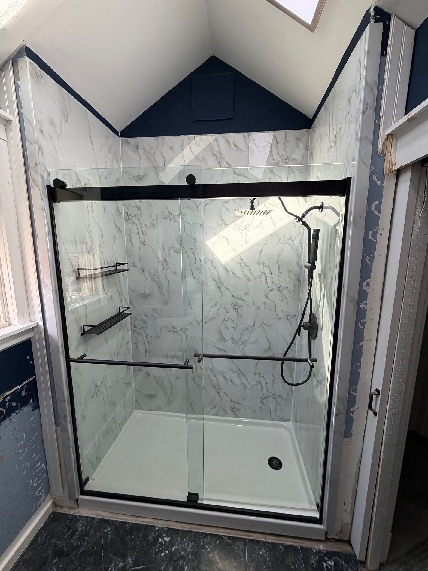 acrylic shower remodel with marble design