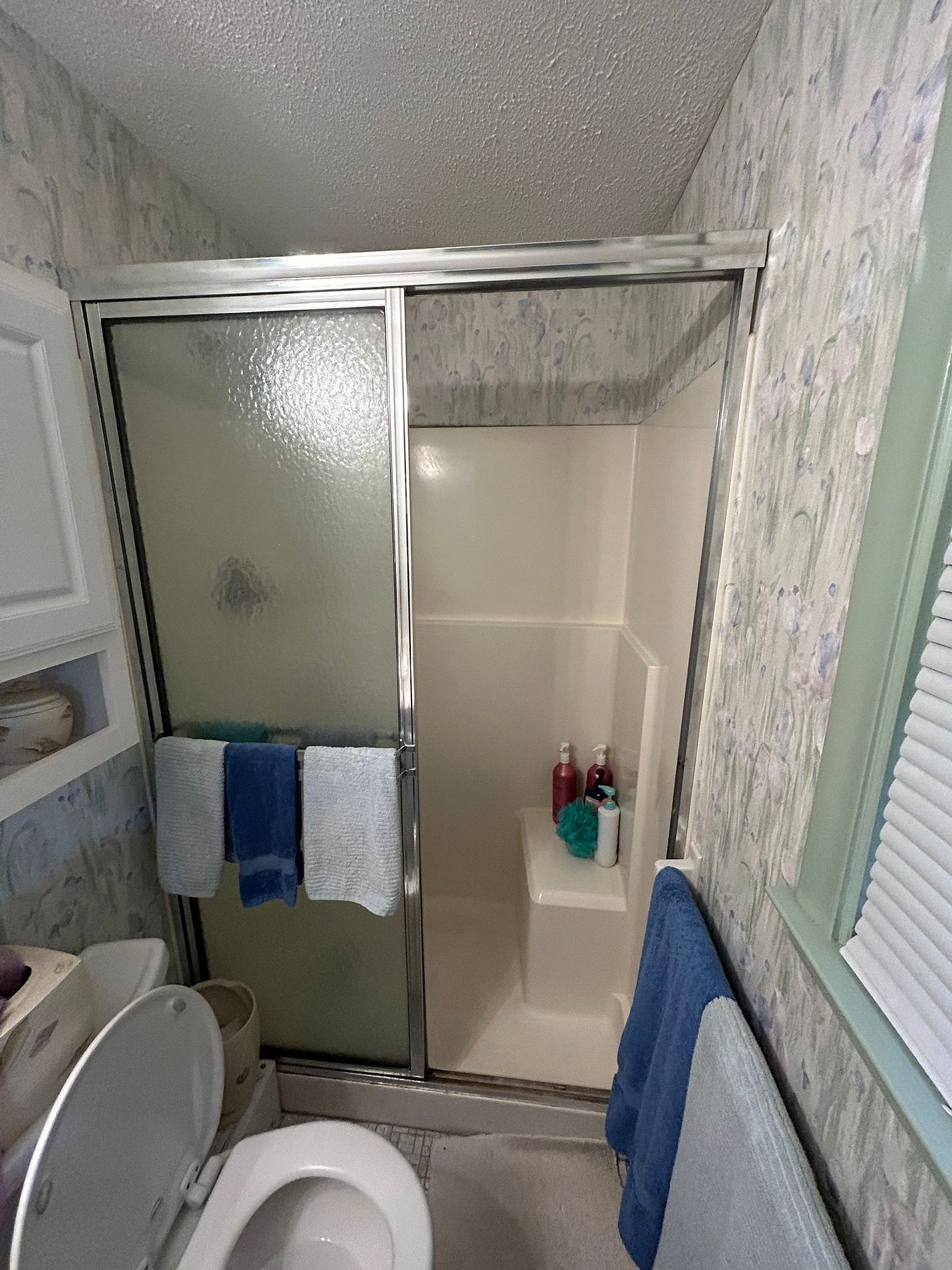 Original tub and shower combination before remodeling on Whitney Circle in Windsor, CT
