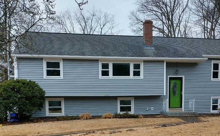 New windows across the front facade of a raised ranch on Edgewood Drive in South Windsor, CT