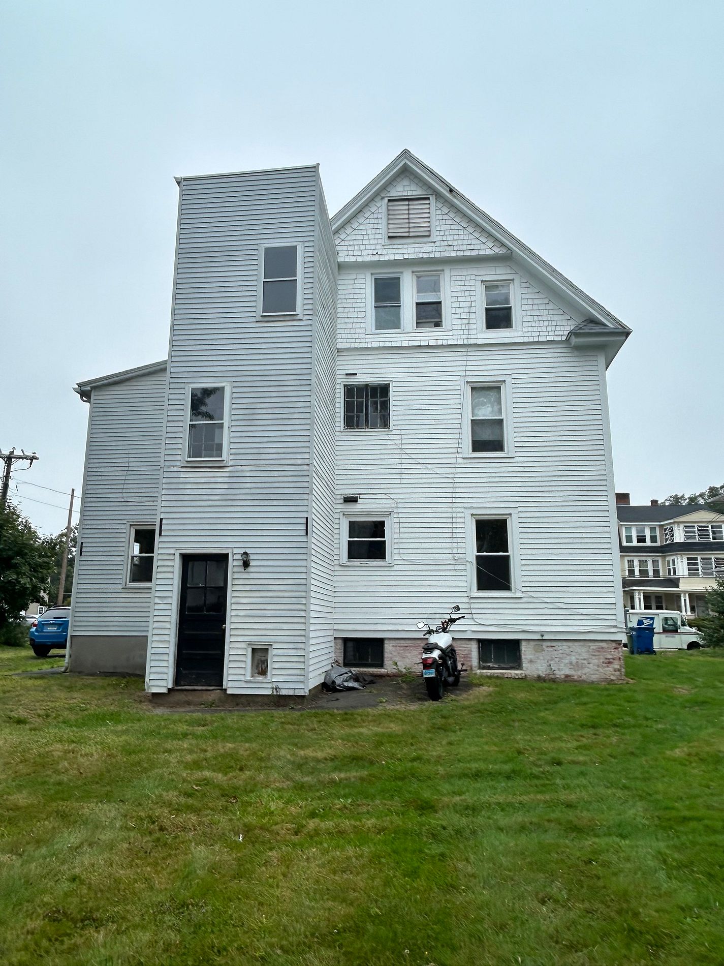 Upper-floor windows prior to replacement on Prospect Street in Windsor, CT