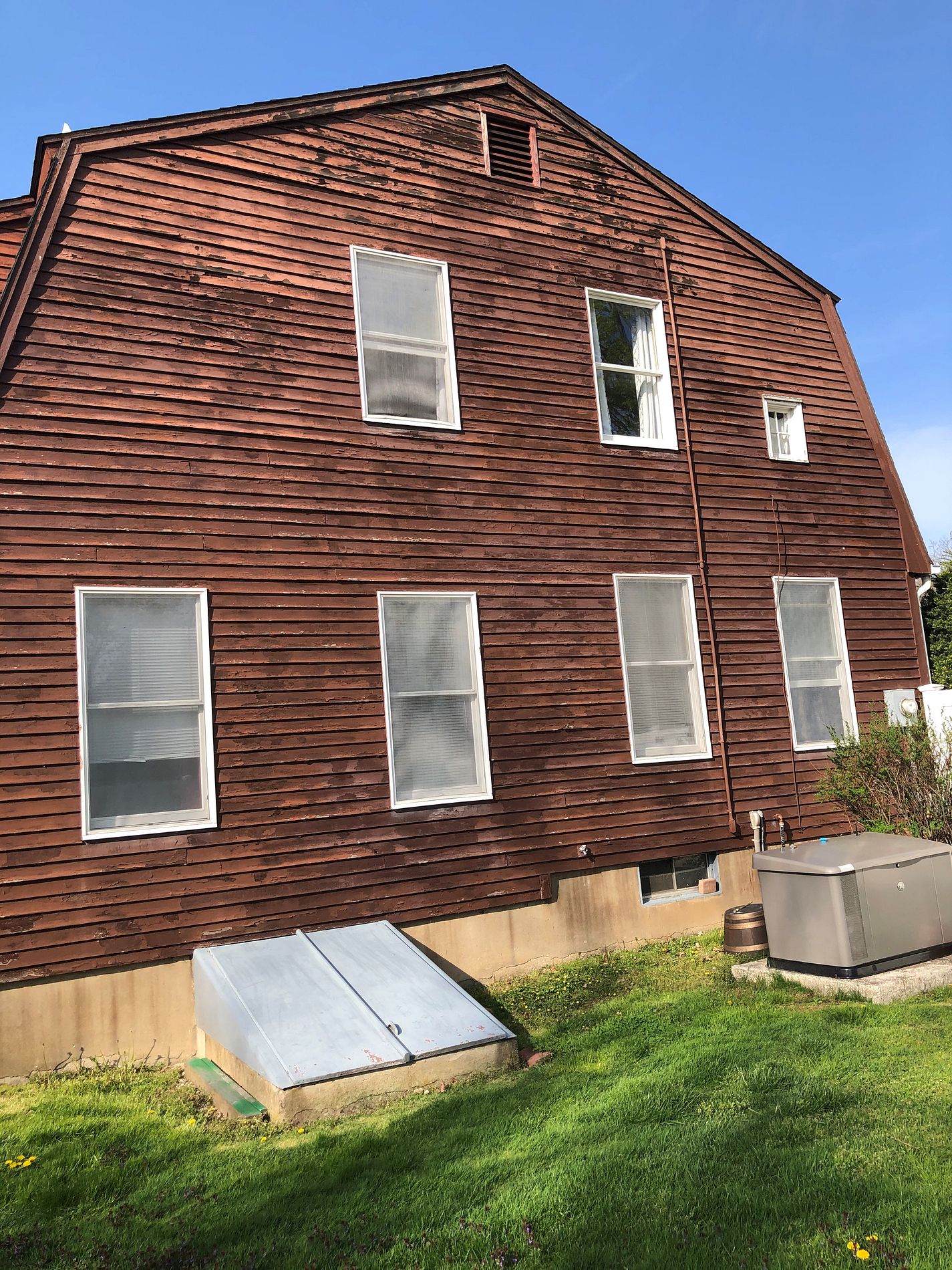 Rear-elevation windows before replacement on Strawberry Hill in Windsor, CT
